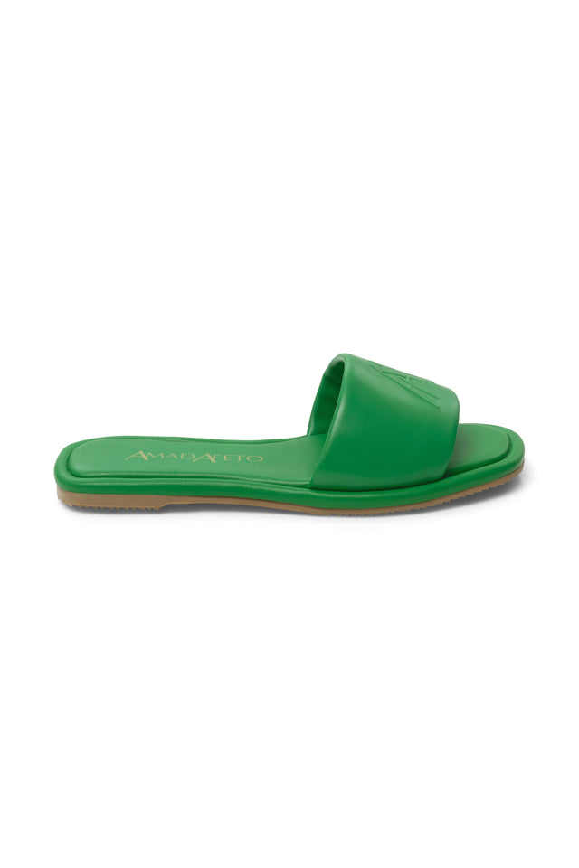 Side view of womens leather green slides